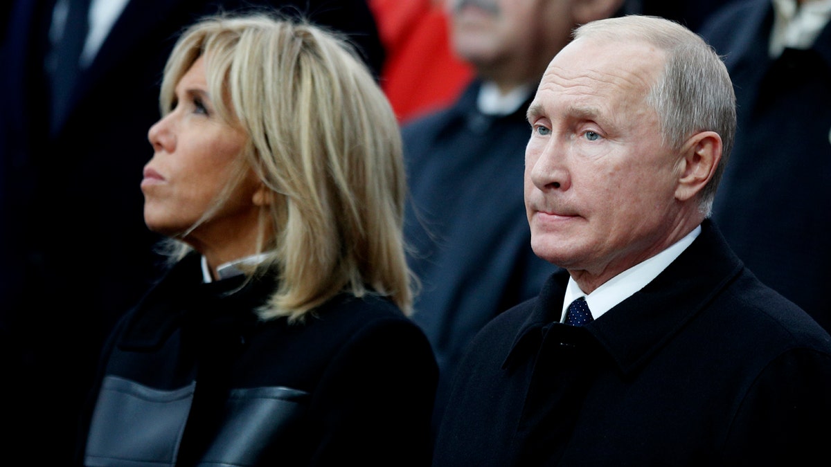 French President's Emmanuel Macron's wife Brigitte and Russian President Vladimir Putin attend ceremonies at the Arc de Triomphe Sunday, Nov. 11, 2018 in Paris.