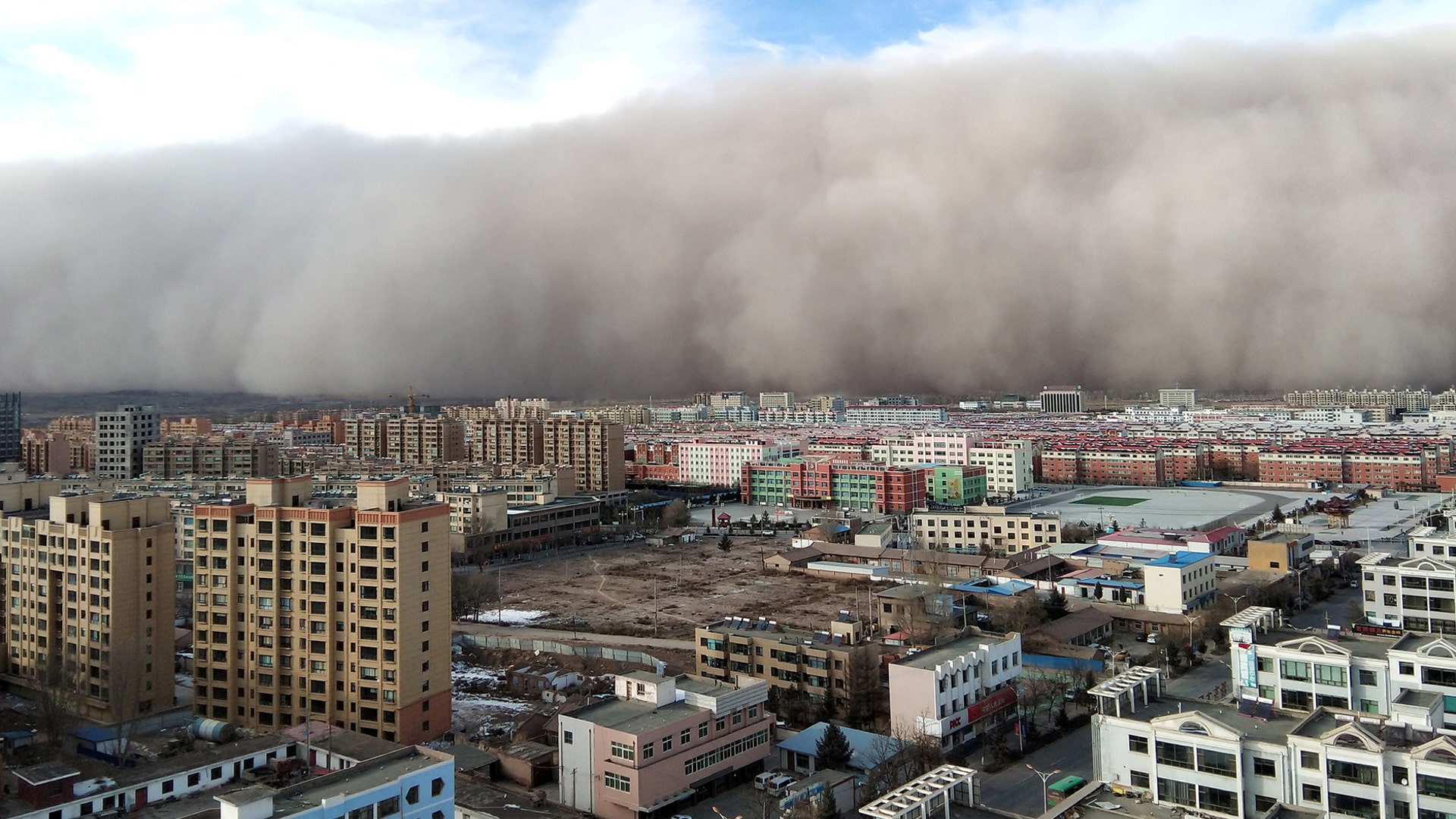 A sandstorm hits the city of Zhangye in Gansu province, China, Nov. 25, 2018.