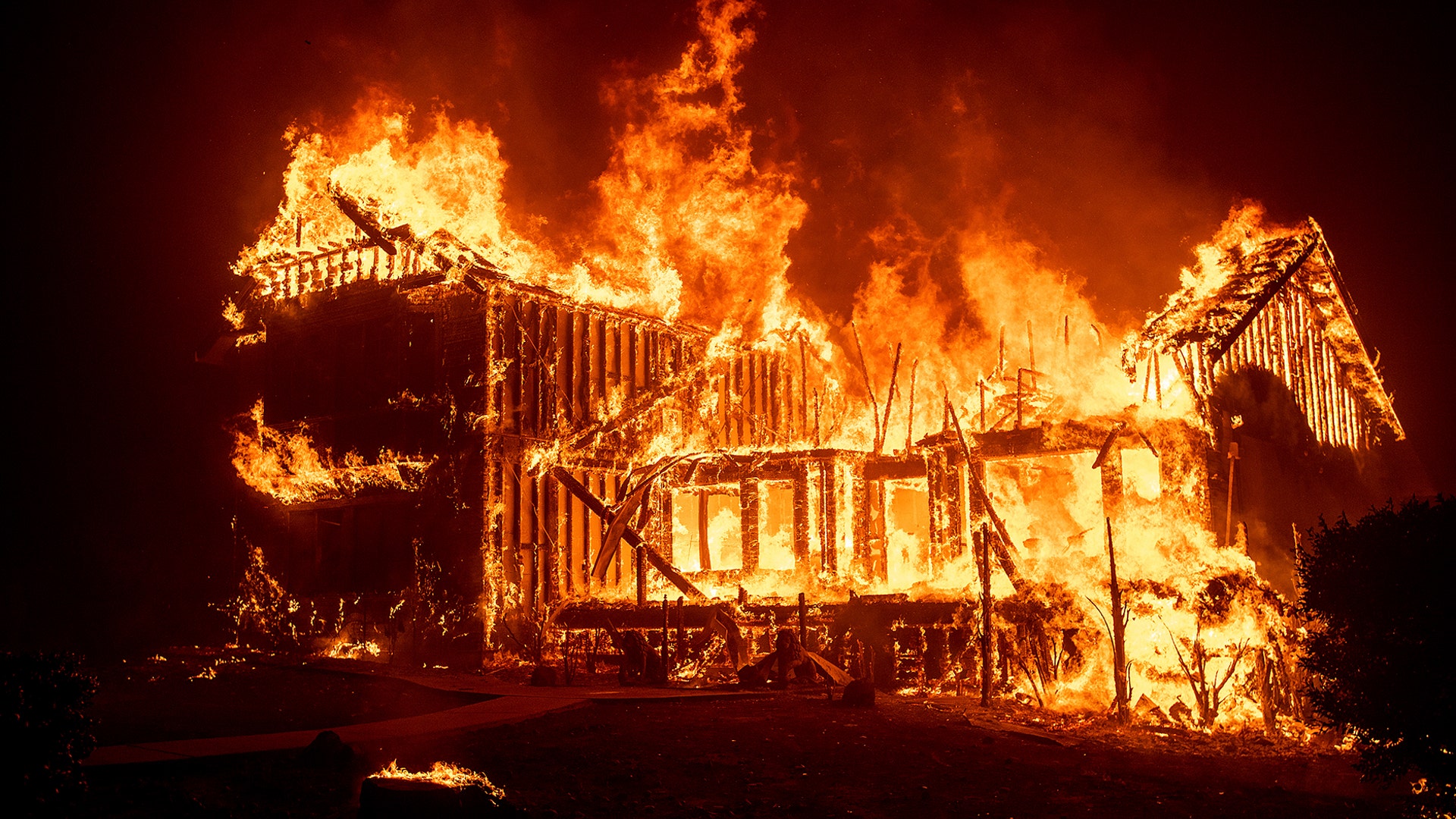 A home burns as the Camp Fire rages through Paradise, California, November 8, 2018. 