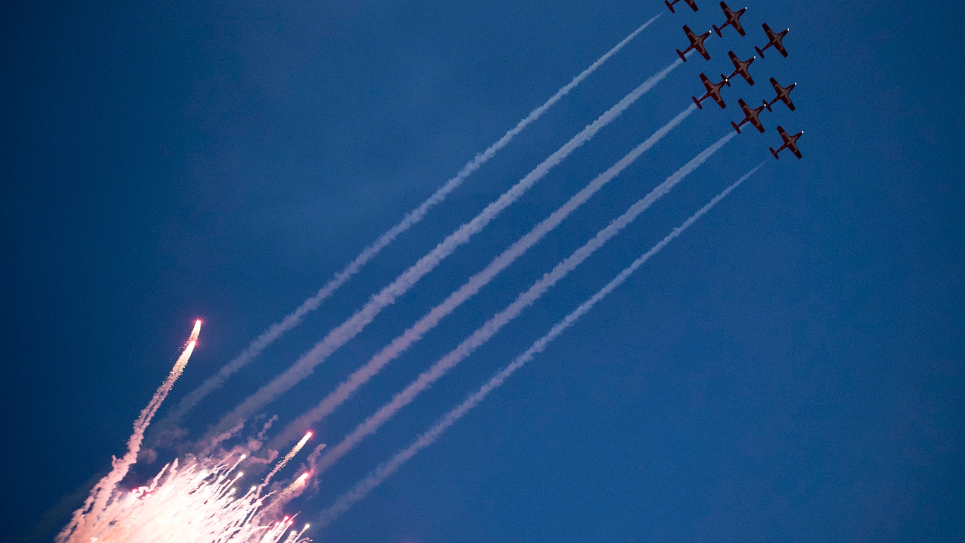 The Canadian Forces Snowbirds perform a flyover in Edmonton, Alberta, Nov. 25, 2018.