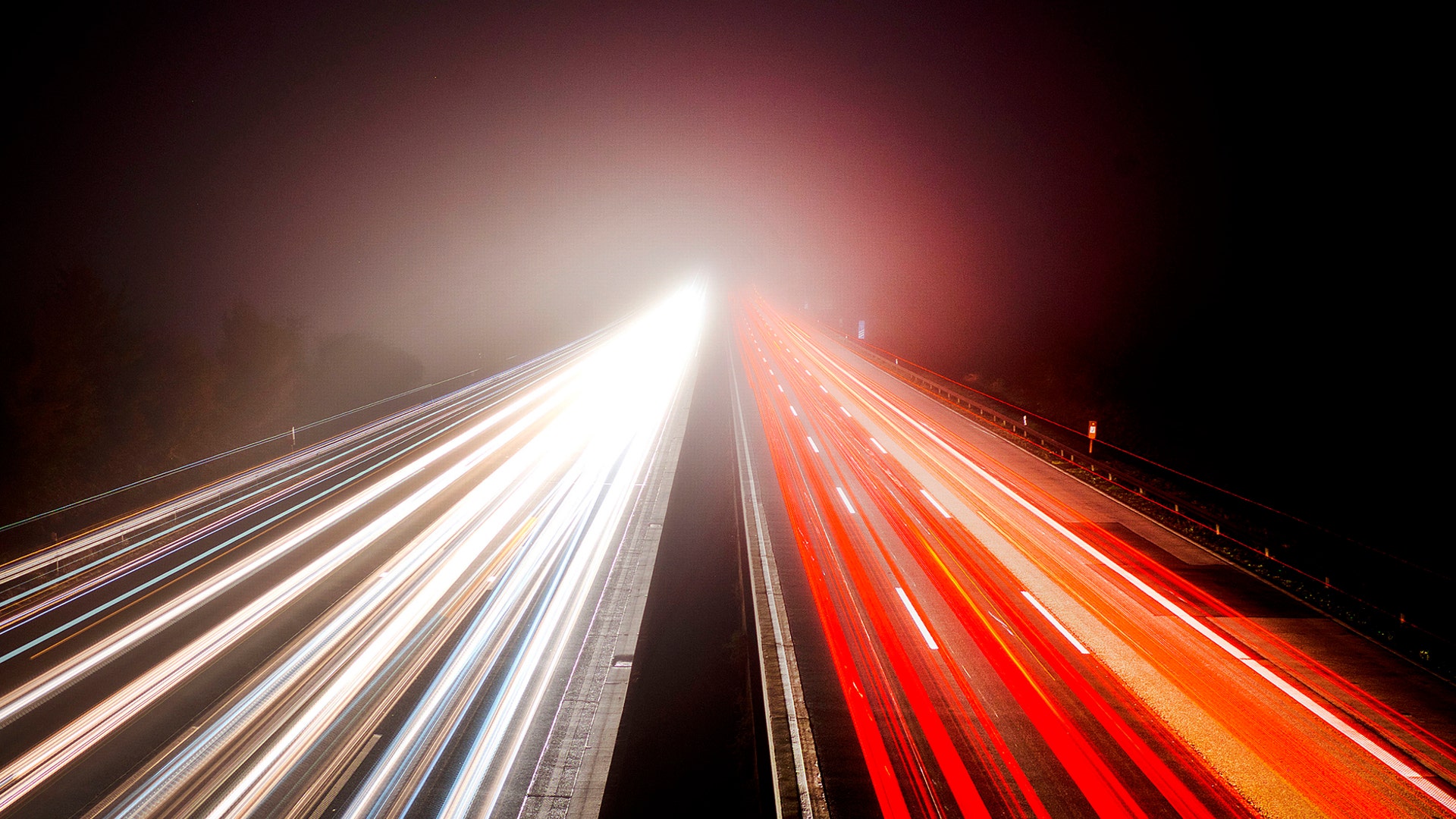 A time exposure shows morning commuters in the fog on a highway in Frankfurt, Germany, November 6, 2018. 