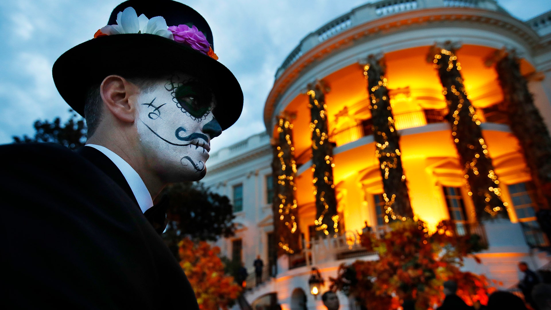 An attendee of a Halloween event wears face paint at the White House as President Trump and first lady Melania Trump give candy to children during a trick-or-treat event in Washington, Oct. 28, 2018. 
