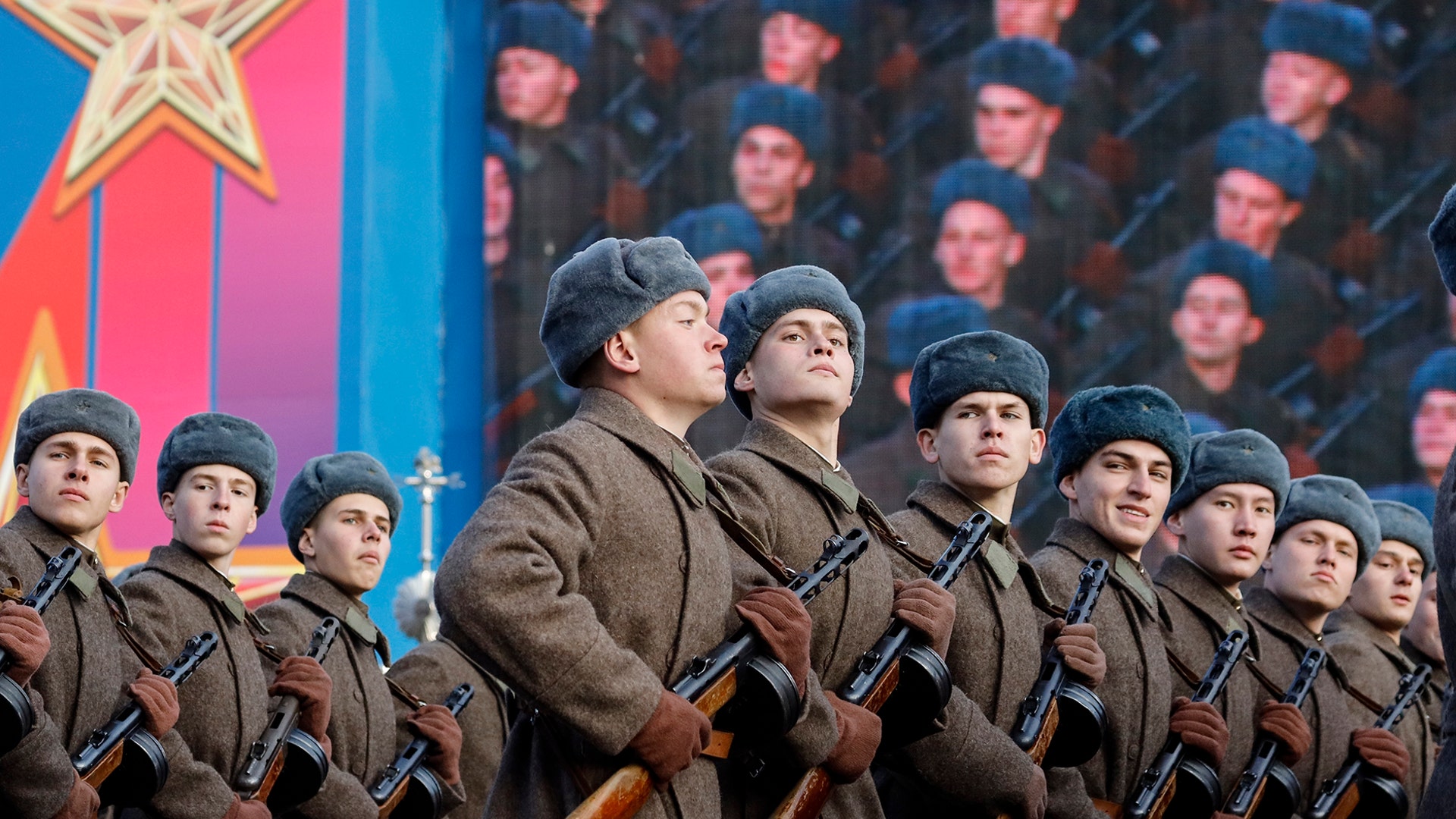 Russian soldiers dressed in Red Army World War II uniforms march during a parade in Red Square, in Moscow, November 7, 2018. 