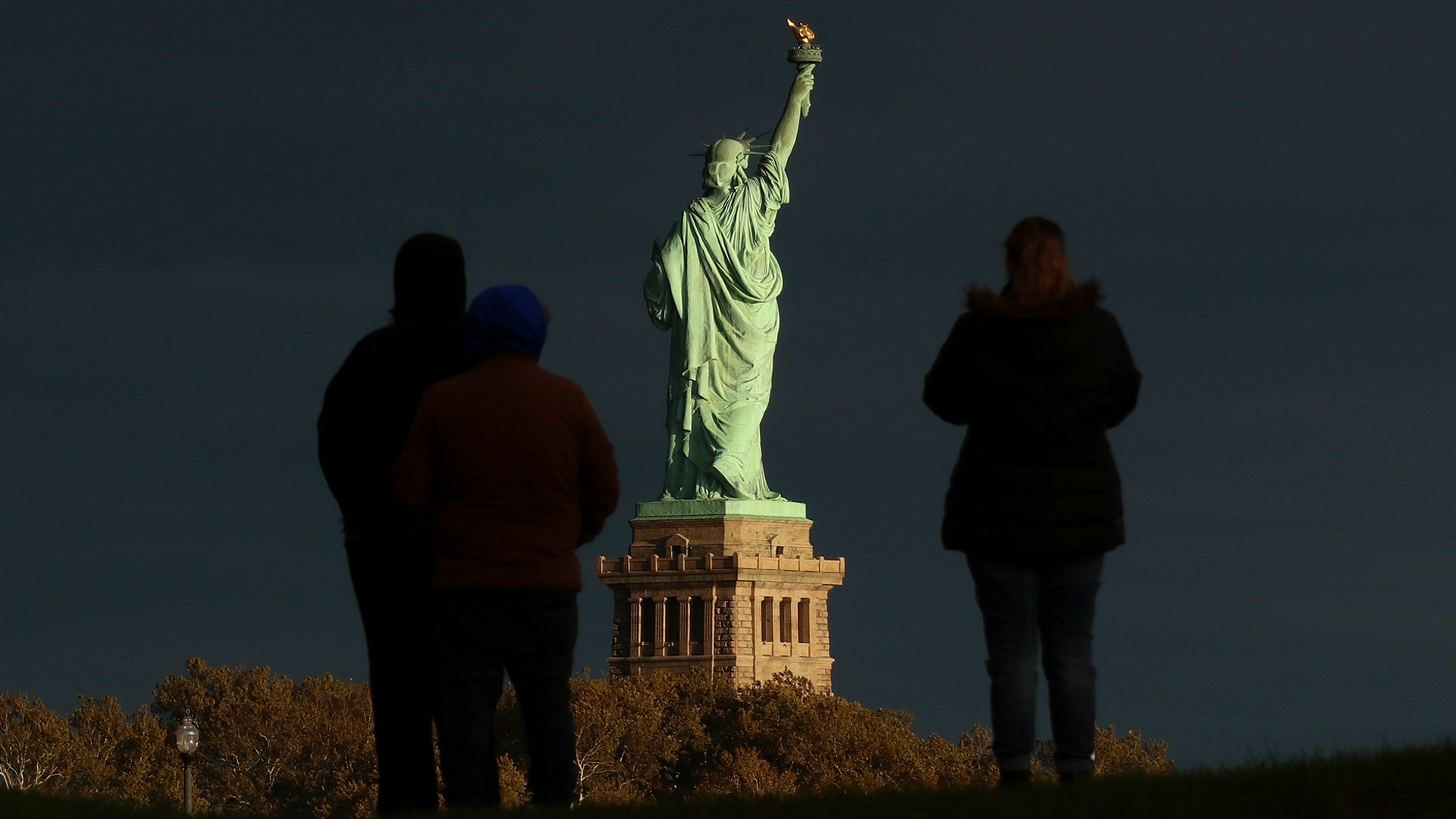 The sun sets on the Statue of Liberty on the 132nd anniversary of its dedication in New York City, Oct. 28, 2018.