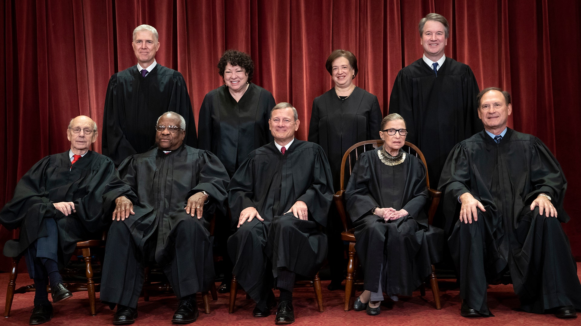 The justices of the U.S. Supreme Court gather for a formal group portrait to include the new Associate Justice Brett Kavanaugh at the Supreme Court Building in Washington, Nov. 30, 2018.