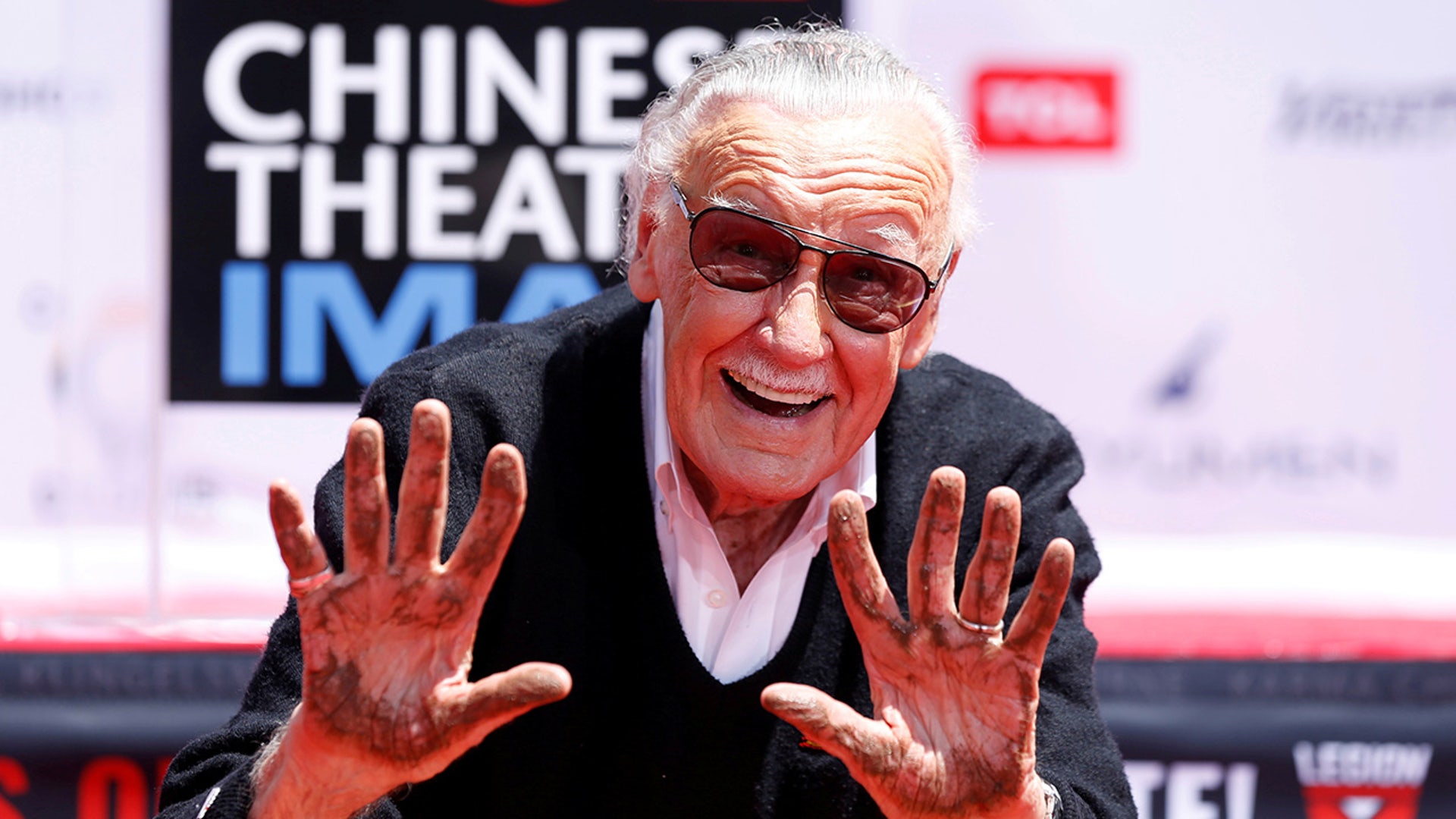 Marvel Comics co-creator Stan Lee shows his hands after placing them in cement during a ceremony in the forecourt of the TCL Chinese Theatre in Los Angeles, Calif. on July 18, 2017. Lee made cameos in over 50 Marvel-related projects. 