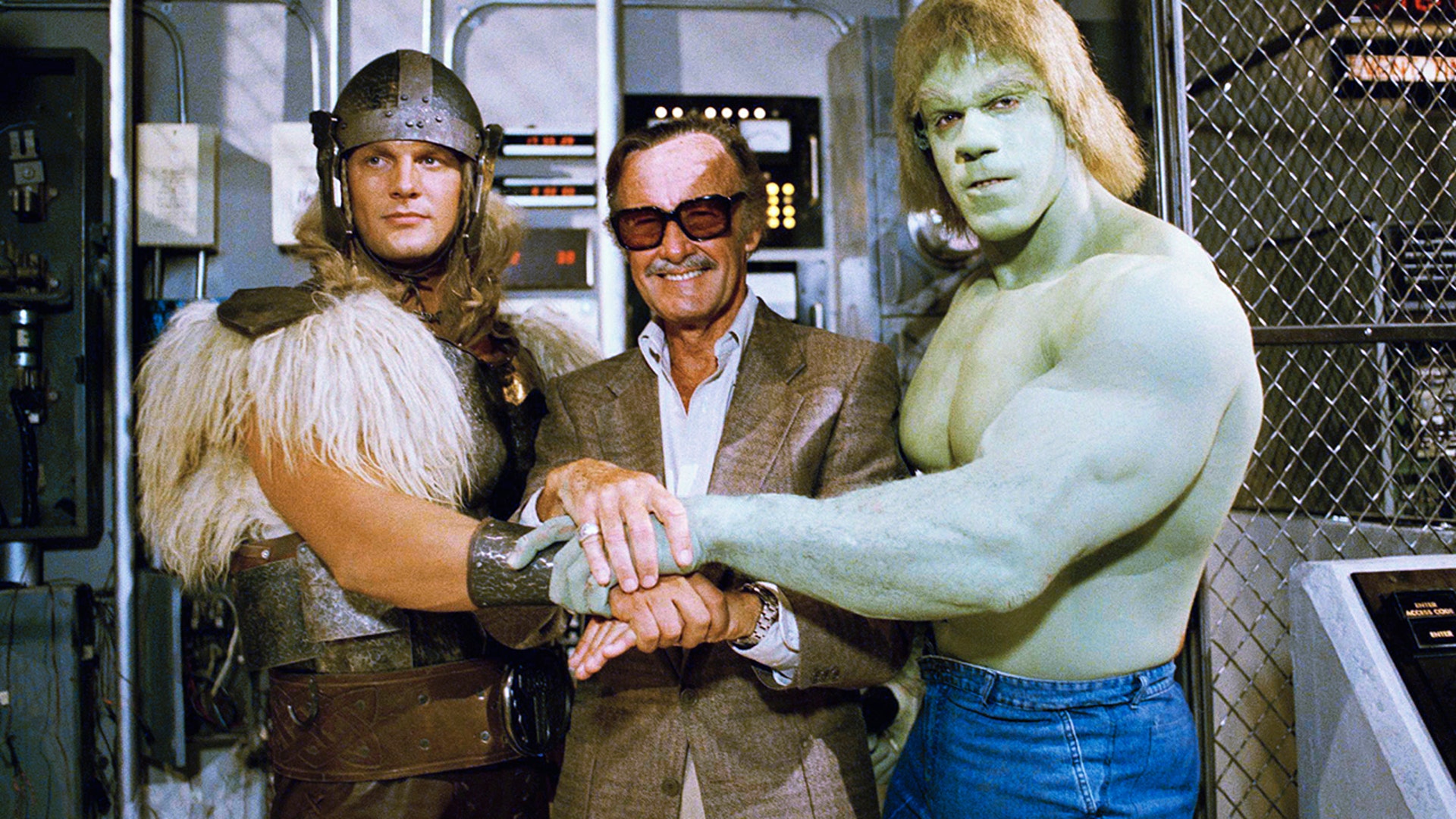 FILE - In this May 9, 1988 photo, comics impresario Stan Lee, center, poses with Lou Ferrigno, right, and Eric Kramer who portray 'The Incredible Hulk' and Thor, respectively, in a special movie for NBC. CBS also turned the Hulk into a successful TV series, with Bill Bixby and Lou Ferrigno portraying the doomed scientist from 1978-82.