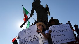 Migrant caravan may be in unwelcoming Tijuana for long-haul, US continues border fortifications