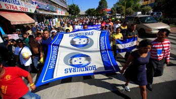 Migrant caravan plows on despite facing border bottleneck after Trump tightens asylum rules