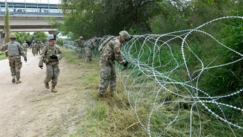 US troops seen setting up barbed wire near Mexico border