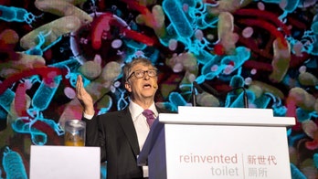 Bill Gates brandishes jar of poop, talks toilet technology