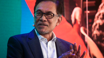 Malaysia's Anwar says wanted 1MDB suspect to get fair trial