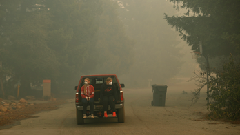 The Latest: 2 arrested for looting fire station during blaze