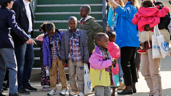 The Latest: Italy's anti-migrant minister greets refugees