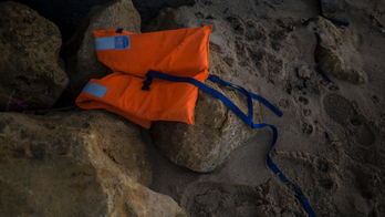 The Latest: Probe into claims US ship delayed migrant rescue