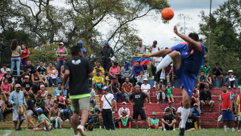 Colombia tries quashing tensions at migrant camp with soccer