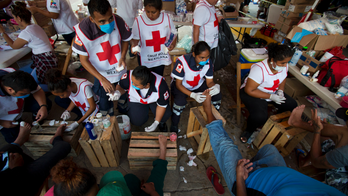 Swollen and blistered feet are big challenge for migrants