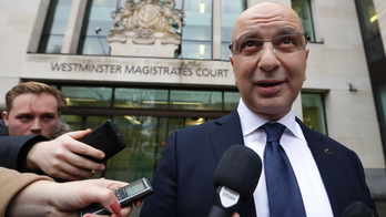 UK court throws out extradition request for Turkish critic