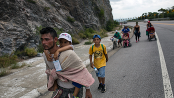 In migrant caravan, kids and parents struggle with long trek