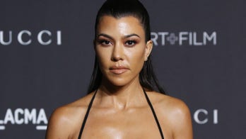 Kourtney Kardashian glows in the dark in white-hot thong bikini
