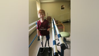 Boy who lost legs to meningitis as a newborn learns to walk on prosthetic limbs