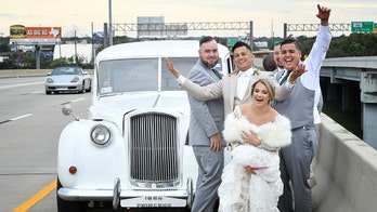 Newlyweds photographed on highway after car breaks down heading to reception