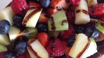 Fruit salad in egg chocolate shell with balsamic vinegar of Modena