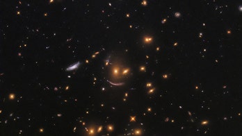 Hubble Space Telescope snaps smiley-shaped cluster of galaxies