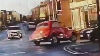Classic car leads police on chase through town in wild video