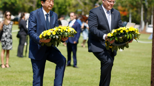 Japan's Abe lays wreath in Australia city bombed in WWII