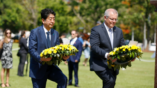 Japan's Abe lays wreath in Australia city bombed in WWII