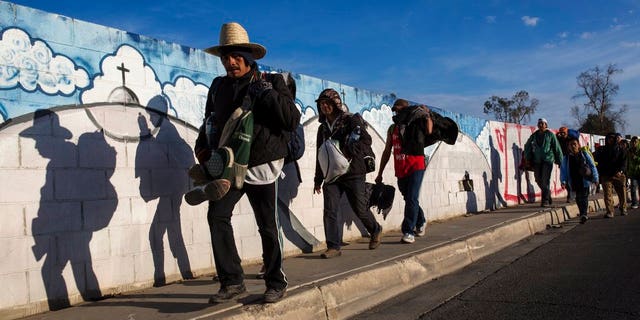 Migrants, who are part of a Central American migrant caravan, leave Mexicali for Tijuana, Mexico, earlier this week. (AP)