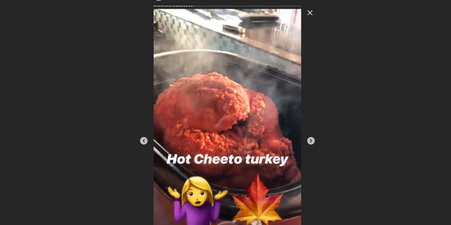 Stefani shows off her Flamin' Hot Cheetos Thanksgiving turkey.
