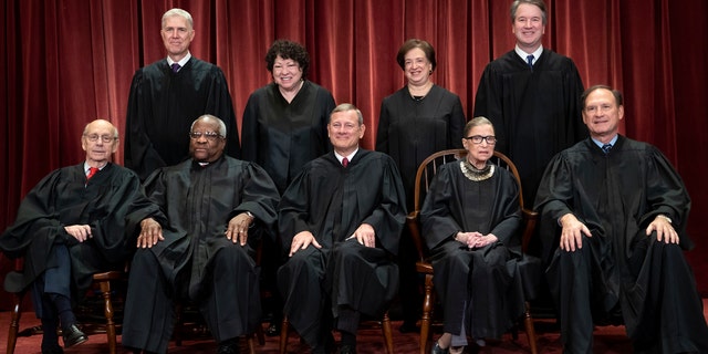 The justices of the U.S. Supreme Court gather for a formal group portrait to include the new Associate Justice, top row, far right, at the Supreme Court Building in Washington, Friday, Nov. 30, 2018. Seated from left: Associate Justice Stephen Breyer, Associate Justice Clarence Thomas, Chief Justice of the United States John G. Roberts, Associate Justice Ruth Bader Ginsburg and Associate Justice Samuel Alito Jr. Standing behind from left: Associate Justice Neil Gorsuch, Associate Justice Sonia Sotomayor, Associate Justice Elena Kagan and Associate Justice Brett M. Kavanaugh. (AP Photo/J. Scott Applewhite)