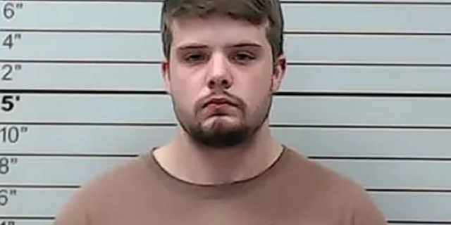 Hunter Newman, 22, allegedly hit a 9-year-old boy who was crossing a street to board a school bus.