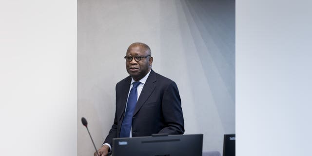 In this Thursday, Jan. 28, 2016 image, former Ivory Coast president Laurent Gbagbo arrives for the start of his trial at the International Criminal Court in The Hague, Netherlands.