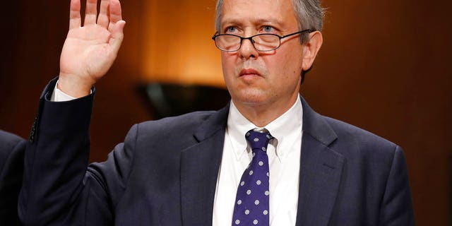 FILE - In this Sept. 20, 2017, file photo, Thomas Farr is sworn in during a Senate Judiciary Committee hearing on his nomination to be a District Judge on the United States District Court for the Eastern District of North Carolina, on Capitol Hill in Washington. (AP Photo/Alex Brandon, File)