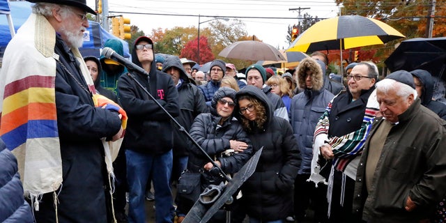 A week after the deadly Pittsburgh synagogue shooting that left 11 people dead, dozens of people reportedly came together for what a former rabbi described as a healing service outside the site of the bloodiest anti-Semitic attack in U.S. history. (AP Photo/Gene J. Puskar)
