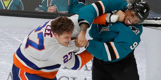 FILE: San Jose left wing Evander Kane, right, fights with New York Islanders left wing Anders Lee.