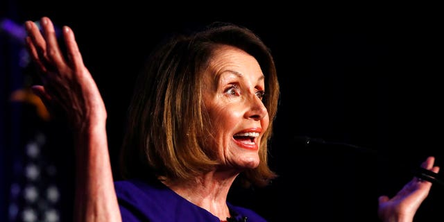 House Democratic Leader Nancy Pelosi of Calif., speaks to a crowd of volunteers and supporters of the Democratic party at an election night returns event at the Hyatt Regency Hotel, on Tuesday, Nov. 6, 2018, in Washington. (AP Photo/Jacquelyn Martin)