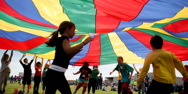 New federal guidelines released on Monday, Nov. 12, 2018, advise that children as young as age 3 should move more, sit less and get more active, and that any amount and any type of exercise helps health.