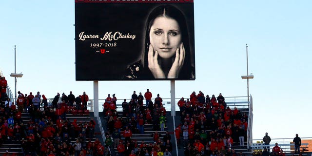 A photo of University of Utah student Lauren McCluskey, who was fatally shot on campus, is projected on the video board as part of a tribute before a football game.