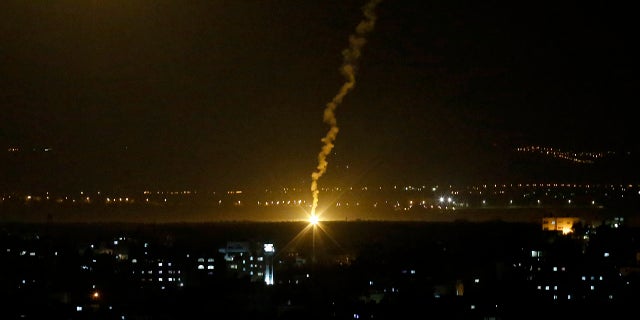 Flares fired from Israeli forces light up the night sky in Gaza City, Monday, Nov. 12, 2018, as the Israeli military launched fighter jets to strike "terror targets" throughout the Gaza Strip.