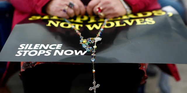 Abuse victims made their presence known, holding signs and talking to members of the media. They said they are frustrated and angry that the bishops appear to care more about the church's structure than its own people. (AP Photo/Patrick Semansky)