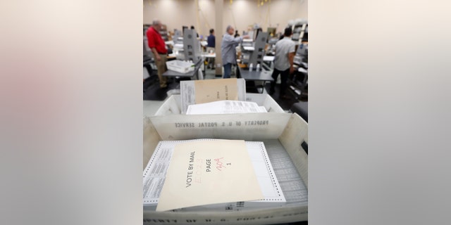 Employees at the Broward County Supervisor of Elections office recount ballots, Nov. 14, 2018, in Lauderhill, Fla.
