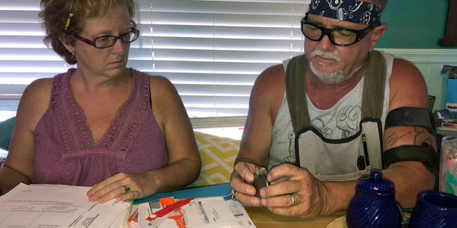 George Davis had three Medtronic spinal-cord implants between 2003 and 2007 after a car accident mangled his back. They temporarily reduced some of his pain, but he said the non-rechargeable batteries that were supposed to last for years never did and he tired of multiple surgical removals.