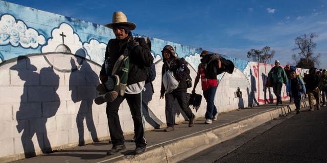 The migrants, who are part of a caravan of migrants from Central America, leave Mexicali to travel to Tijuana, Mexico on Tuesday, November 20, 2018. The tension has settled while near 3,000 caravan migrants have poured into Tijuana in recent days, after more than a month late. road.