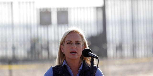 Secretary of Homeland Security Kirstjen Nielsen speaks in front of the border wall separating Tijuana, Mexico, and San Diego.