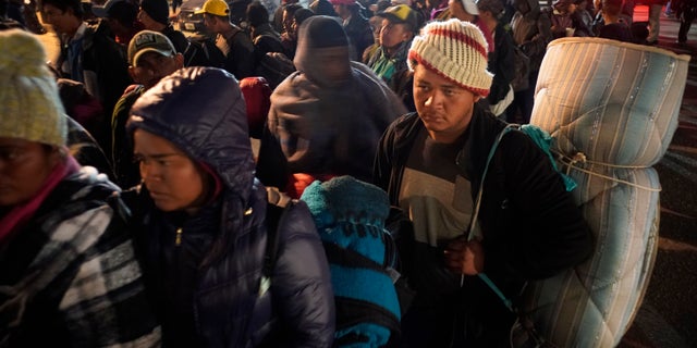 Central American migrants are waiting for access to the Tijuana housing facility in Mexico on Tuesday, November 20, 2018. At least 3,000 migrants have arrived in Tijuana and the federal government estimates that the number migrants could reach 10,000 in the coming weeks and months. (AP Photo / Ramon Espinosa)