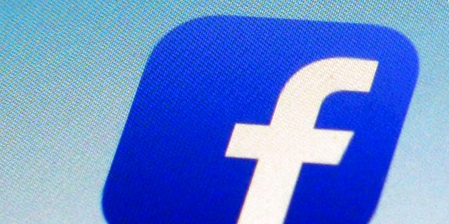 FILE - This Feb. 19, 2014, file photo, shows a Facebook app icon on a smartphone in New York. (AP Photo/Patrick Sison, File)